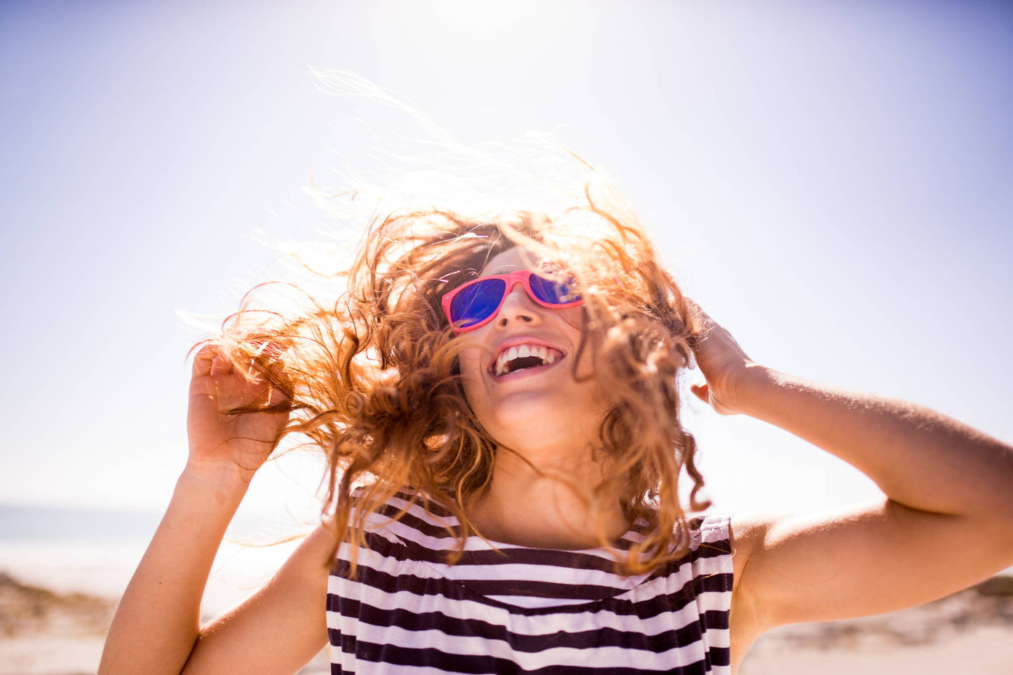 How The Sun Affects Your Hair & How to Protect It